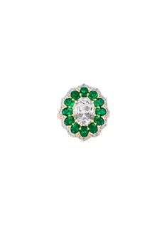 The Tate Cocktail Ring features a 2.5-carat oval lab-grown white sapphire, encircled by oval emeralds and round white sapphires or diamonds. Holiday Production Time: This made to order ring ships 5 - 7 weeks from purchase date. Please place your order by November 1st for guaranteed delivery before December 25th. Orders placed after this date cannot be guaranteed to arrive in time for the holidays. Custom styles can only be returned for store credit.The Fine Print: Metal: 18k gold coated silver o Oval Emerald Ring With Rose Cut Diamonds, White Oval Halo Ring With Rose Cut Diamonds, White Oval Diamond Cluster Ring, Gia Certified Oval White Wedding Rings, Fine Jewelry White Emerald Rings, Oval Halo Ring With Center Stone In White, White Oval Halo Ring With Center Stone, Timeless Oval White Cluster Ring, White Oval Emerald Anniversary Ring