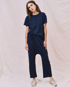 A look all its own, The Jersey Crop. is an elastic waist jersey pant with our signature dropped rise and a wider straight leg. The ultimate in casual, we love this pant with a tee and sandals. Handcrafted locally in Los Angeles, our process ensures beauty and uniqueness—no two pieces are alike. 100% Cotton Model is 5'9" wearing size 1 Size 1 - Inseam: 20 1/4" Rise: 16 5/8" Leg Opening: 8 3/4" Machine Wash Cold Tumble Dry Low Made in the U.S.A. Emily And Meritt, Jersey Pants, Two Pieces, Womens Tees, Elastic Waist, Straight Leg, Jumpsuit, Hollywood, Angeles