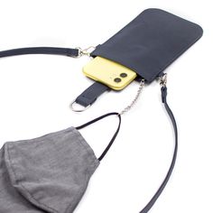 Our Pouch Purse is a perfect hands-free crossbody! Slip your phone in and secure with the magnet strap (fits most phones with case); also includes RFID-protected built-in card slots, a chain and clip for your keys or mask, and a detachable crossbody strap. Specific Details Include: Detachable 55" crossbody strap Magnet strap close for easy opening RFID protected built-in card slots inside Chain with clip for mask or keys Silver hardware Vegan leather Dimensions: 3.5”W x 6.75”H Perfect Hands, Pouch Purse, Monogrammed Items, Charming Charlie, Floral Stripe, Buy One Get One, Navy Pink, Style Gift, Color Stripes