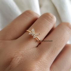 Detail: 925 Sterling Silver CZ Butterfly Ring, Dainty Pave CZ  Butterfly Ring, Diamond Butterfly Ring, CZ Butterfly lovers Ring,Butterfly Ring 💜Item Name: diamond butterfly ring  💜Metal : 925 sterling silver  💜Gemstone:cubic zirconia 💜Ring Size : All Standrd ring size available Custom Option:  Yes 💜jewellrybypoonam💜 This exquisite 14k yellow gold moissanite diamond ring is the perfect symbol of your love and comtmitment. Designed with a timeless elegance, this ring is sure to take her brea Diamond Crystal Toe Ring As Gift, Stackable Rings With Sparkling Stones For Gift, Fine Jewelry Diamond Midi Rings As Gift, White Gold Cubic Zirconia Midi Rings As Gift, Dainty Diamond Crystal Ring For Gift, Dazzling Stackable Open Rings As Gift, Dazzling Stackable Open Rings For Gifts, Dazzling Open Ring Stackable Rings As Gift, Fine Jewelry Rings With Sparkling Stones For Gifts