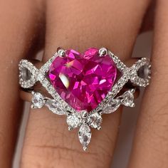 M A T E R I A L S 14k White Gold 14k Yellow Gold 14k Rose Gold S T O N E S Cruelty Free ~ Lab Pink Sapphire ~ Internally Flawless / Colorless Moissanites in Pictures * Customizable Center Stone* ~ Heart Center Stone : 3.00ct ~ Side Stones : 0.25ct total D I M E N S I O N S ~ Band: 4mm - 2mm BAND ~ Total Stones : 0.25ct total D I M E N S I O N S ~ Band: 2mm ~ Chevron V allows 3-4mm of space to pair with R I N G C A R E ~ Simple instructions to care for the ring is not expose your jewelry to chemi Heart-shaped Moissanite Promise Jewelry, Heart-shaped Moissanite Wedding Ring In White Gold, Diamond Cut Heart Ring For Anniversary, Heart-shaped Diamond Cut Ring For Anniversary, Heart Shaped Diamond Cut Promise Ring, Heart Cut Moissanite Wedding Rings, Wedding Heart Ring With Cubic Zirconia In Prong Setting, Heart Cut Diamond Wedding Ring With Accent Stones, Heart-shaped Moissanite Promise Ring