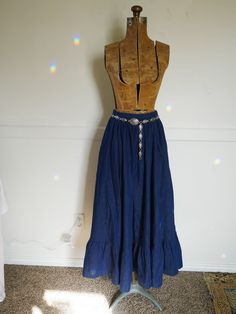 Vintage Ralph Lauren Denim Prairie Skirt  1980s Early Blue Label May be a ball Skirt or maxi on some Absolutely Stunning Classic Ralph Lauren Western skirt, free flowing drape. Has pockets, which add so much fun to this formal look. Dress up with a classy hand knit Ralph Lauren winter themed tube/tank top Or dress down with your favorite t shirt or western denim snap shirt and cowboy boots Southwestern Cowboy/Western kick to classic eveningwear silhouette Dark wash indigo denim Timeless and a wonderful basic that can be worn all year  Zipper in back and button closure  Cottage Core, Prairie 100% Cotton Near mint Listing is for skirt only, concha belt not included. Size  4 Approximate measurements inches (lying flat) waist: 24 , may be able reposition button to make it a 25 inch waist lengt Bohemian High Waist Dark Wash Bottoms, Bohemian Dark Wash High Waist Bottoms, Denim Blue Bohemian Long Skirt, Denim Blue Long Bohemian Skirt, Bohemian Denim Blue Skirt, Bohemian Long Denim Blue Skirt, Bohemian Long Denim Skirt, Bohemian Fitted Medium Wash Bottoms, Bohemian Fitted Medium-wash Bottoms