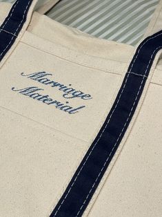 a canvas tote bag with blue trimmings and the words venice international printed on it