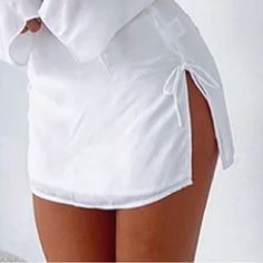 Nwt - Ordered Two Sizes No Longer Available Online ! New Flame Mini Skirt In White. Featuring Zipper Centre Back, Side Leg Split With Tie Detail And Lined Fabric. - 100% Polyester Added Picture Of How The Size Medium Fits Me !! Message With Reasonable Offers Casual Stretch Skirt With Split Hem, Spring Vacation Bottoms With Split Hem, Summer Vacation Bottoms With Split Hem, White Mini Skort For Vacation, White Mini Length Skort For Vacation, Fitted Skirt With Split Hem For Summer, Spring Day Out Bottoms With Split Hem, Spring Bottoms With Split Hem For Day Out, Summer Day Out Skirt With Split Hem