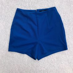 Forever21 Cobalt Blue High Waisted Short. Textured Material. Bright Bold Color. Zip Closure In Back. Size Xs, Fits Tts 00/0. Never Worn. Smoke Free Home. Inseam: 2” Waist: 11” Trendy Blue Shorts With Short Inseam, Trendy Blue Mini Length Bottoms, Trendy Blue Mini Bottoms, Chic Blue Bottoms For Date Night, Blue Stretch Mini Shorts, Stretch Blue Mini Shorts, Chic Blue Shorts For Night Out, Blue Mini Bottoms With Built-in Shorts, Blue High-waisted Shorts For Night Out