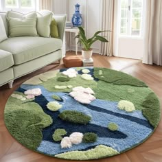 a living room with a couch and rugs on the floor, in front of a window