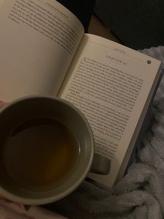 a cup of tea and an open book