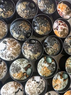 many bowls filled with different types of desserts on top of each other in them