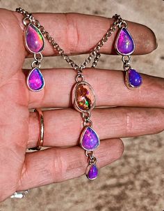 "Opal Drip Necklace Ethiopian solid opals dyed purple Mexican fire opal with purple and green flash Center strand is about 2\" long Side strands are 1.25\" long Sterling silver rolo chain 16\" long Makers mark on back Handmade with love 💗" Turquoise Choker, Turquoise Rings, Rolo Chain, Opal Necklace, Opal Jewelry, Opal Rings, Adjustable Bracelet, Fire Opal, Beautiful Rings