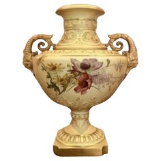 an ornate vase with flowers painted on the outside and gold trimming around the base