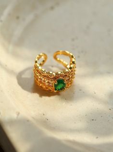 Metal: 18K Recycled Gold Plated On Brass Gemstone: Cubic Zirconia Ring Higt: 13mm Size: Open Adjustable Weight: 6g Luxury Gold Emerald Open Ring, Gold Diamond Open Ring With Gemstone, Gold Diamond Ring With Gemstone In Open Style, Luxury Gold Emerald Ring With Cubic Zirconia, Gold Crystal Ring For Formal Occasions In May, Gold Crystal Ring For May Birthstone Events, Gold Crystal Ring For May Birthstone Formal Occasion, Luxury Gold Emerald Ring For May Birthstone, Elegant Gold Crystal Ring For May Birthstone