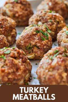 turkey meatballs on a baking sheet with the words turkey meatballs above it in front of them