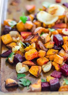 roasted beets and potatoes on a wooden cutting board