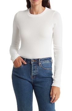 Refresh your essentials with this long-sleeve crop top cut from a stretchy ribbed knit. 18 1/2" length Crewneck Long sleeves 97% polyester, 3% spandex Machine wash, tumble dry Made in the USA Model stats: 5'10" height, 32" bust, 25" waist, 36" hip. Model is wearing size Small. Stretch Long Sleeve Cropped Sweater With Ribbed Neckline, Stretch Cropped Sweater With Ribbed Neckline And Long Sleeves, Trendy White Ribbed Cropped Sweater, Stretch Ribbed Long Sleeve Cropped Sweater, Ribbed Long Sleeve Cropped Sweater For Spring, White Ribbed Cropped Sweater, White Long Sleeve Cropped Sweater With Ribbed Neckline, Fitted White Ribbed Cropped Sweater, White Cropped Sweater With Ribbed Neckline And Long Sleeves