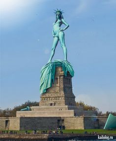 the statue of liberty is standing in front of the water