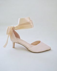 Classic satin pointy toe low heel shoes adorned adorned with matching satin or sheer ribbons that ties to an oversized bow around ankle to add elegant grace to any ensemble. Simple and easy wear for bridal wear, bridesmaids, holiday party, wedding parties, and any special occasions. DETAILS: HEELS: 2 inches UPPER: Synthetic upper and lining MATERIALS: Manmade outsole ORIGIN: Imported Spring Heels With Satin Bow And Ankle Tie, Spring Ankle Tie Heels With Satin Bow, Evening Heels With Ankle Tie Ribbon, Evening Heels With Ribbon Ankle Tie, Evening Ankle Tie Heels With Ribbon, Summer Evening Ankle-tie Wedding Shoes, Ankle Tie Wedding Shoes For Summer Evening, Ankle Tie Heels With Satin Bow, Summer Wedding Shoes With Ankle Tie For Evening