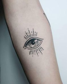 an all seeing eye tattoo on the arm