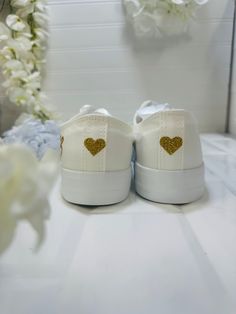 You can play with the colors with these Handmade Bridal Sneakers. Let's us know your favorites and we will do our job. Personalized bride flat shoes tennis looks fabulous. Just after your heels betray you at the wedding, get your bride custom flat shoes and keep dancing. Bedazzled with sequins, rhinestones, glitter, and other beautiful details.🌟Includes🌟- Pick shoelace colors.- On the sides of the shoe, the idea/name/date is printed in solid or glitter color.- The laces are personalized with t Low-top Glitter Sneakers For Wedding, White Round Toe Sneakers For Bridal Shower, White Slip-on Party Sneakers, White Slip-on Sneakers For Party, White Casual Sneakers For Wedding, White Casual Wedding Sneakers, Bride Flat Shoes, Unique Flat Shoes, Bride Shoes Flats