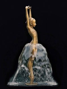 a statue is shown in the water with its arms up and hands behind her head