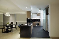 a modern kitchen and dining room are seen in this image