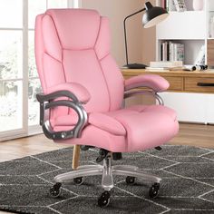 a pink office chair sitting on top of a rug