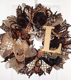 a leopard print wreath with the letter i on it