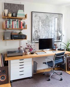 an image of a home office with bookshelves on the wall and shelves above it