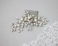 Classic sparkles are waiting for you! Perfectly round ivory pearls are accented with silver sprays of round and marquise clear crystal stones to create this decorative bridal hair comb. It measures about 4.5 inches long and 2 inches high. Silver Spray, Wedding Comb, Pearls Wedding, Ivory Pearl, Crystal Stones