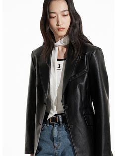 This is a comfortable and casual jacket that is made out of high quality vegan leather fabric. With a unique design with two button breast closure and shoulder padding, it is comfortable to wear in a daily life. - Padded shoulder detail- Vegan leather with minimal wrinkles- Single two button breast closure Chic Leather Blazer With Snap Buttons, Leather Blazer With Snap Buttons For Office, Office Leather Blazer With Snap Buttons, Single-breasted Biker Jacket For Spring Workwear, Trendy Leather Jacket With Button Closure, Leather Button-up Blazer For Work, Leather Blazer With Snap Buttons And Lapel Collar, Notch Lapel Leather Jacket With Snap Buttons For Work, Trendy Single-breasted Leather Jacket