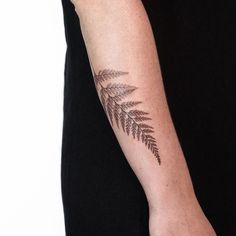 a person with a tattoo on their arm