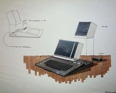 an old laptop computer sitting on top of a wooden table