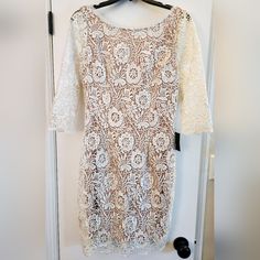 White Lace Style Dress. Tan Lining Underneath. Low Cut Back Neck Line. Sleeves Do Not Have Lining. Bought For My Wedding And Never Worn. Top To Bottom Lenght: 37" Sleeve Length: 17" Armpit To Armpit: 17" Beige Sheath Mini Dress For Wedding, Off White Lace Mini Dress For Wedding, White Fitted Sheath Lace Dress, Elegant Off-white Lace Dress For Party, Elegant Off White Lace Dress For Parties, Fitted Off-white Lace Dress For Party, Fitted Off-white Lace Party Dress, Fitted Off White Lace Dress For Party, Off White Fitted Lace Dress For Party