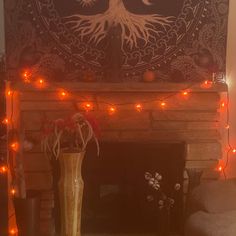 a living room with a fireplace decorated for halloween