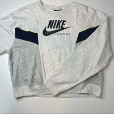 Super Cozy Crewneck By Nike! Heather Gray Sweatshirt With Navy Colorblock Details. Yellow Stitching Details. Black Signature Decal. Multiple Sizes. Oversized Fit. Nwt! Authentic I Am A Posh Ambassador, So Purchase With Confidence No Tradesno Pplno Low Balls Sporty Gray Color Block Tops, Gray Color Block Crew Neck Sweatshirt, Gray Crew Neck Tops For Athleisure, Gray Color Block Crew Neck Top, Nike Gray Tops For Fall, Nike Gray Sportswear Top, Sporty Gray Crew Top, Nike Gray Sporty Top, Vintage Nike Sweatshirt