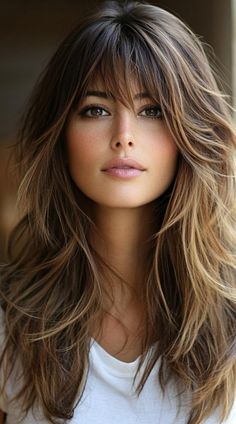 Get inspired with 24 unique long layered hair with bangs ideas! From soft, cascading layers to bold bangs, discover how these hairstyles can add volume and dimension to your hair. Perfect for anyone wanting a fresh and trendy look. Wispy Side Bangs Straight Hair, Long Hairstyles With Long Layers, Short And Long Layers Haircut, Medium Hair Bangs Hairstyle, Long Hairstyles With Wispy Bangs, Across Bangs Long Hair, Big Bangstyle Hair, Bottleneck Bangs Wavy Hair, Long Choppy Bangs