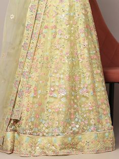 Introducing our glamorous light yellow sequins net engagement wear lehenga choli, a stunning piece that is sure to make you stand out on any special occasion. This fully stitched lehenga set comes in a beautiful light yellow color, made from high-quality net material adorned with exquisite sequin work and multi-thread embroidery.
The matching choli features the same intricate sequin work and thread embroidery, while the net dupatta completes the look with sequin work, multi-thread work, and a ch Floor-length Pista Green Lehenga With Sheer Dupatta, Pista Green Floor-length Lehenga With Sheer Dupatta, Pista Green Lehenga With Intricate Embroidery For Party, Floor-length Resham Embroidered Net Lehenga, Floor-length Pista Green Lehenga For Eid, Yellow Semi-stitched Gown With Sheer Dupatta, Semi-stitched Yellow Gown With Sheer Dupatta, Pista Green Floor-length Lehenga For Reception, Pista Green Floor-length Lehenga For Party