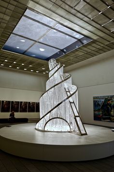 a large white sculpture sitting in the middle of a room