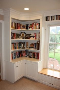 a corner book shelf with many books on it