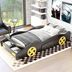 a bedroom with a bed made to look like a race car in the middle of it