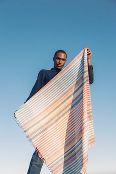 Handwoven Cowboy Scarf "Olema" is a technicolor dream stripe scarf for any season! The open fringe shows off the fascinating texture of handspun yarn. Layered on top of these colorful stripes is a cross-grain stitch of supplementary weft, because well, “more is more”. Woven with Khadi (handspun) cotton and silk this weave is gauzy with subtle textures and shine. Scarf Details Khadi (handspun) Cotton and Silk Handwoven in Maheshwar, India Yarns dyed AZO-Free Dyes Approximately 38" by 39" Hand was Cowboy Scarf, Fabric Folds, Stripe Scarf, Silk Noil, Woven Scarf, Handmade Yarn, Handwoven Scarf, Woven Scarves, The Cowboy