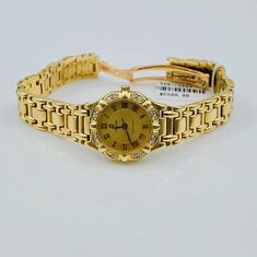 Women's Concord Sarento 24mm Solid 18K Yellow Gold Band Watch, with Roman Numeral Gold Dial, and Diamond Bezel. Includes Mahogany Box. Brand: Concord. Case Back: Solid. Gender: Women's. Condition: Pre-Owned. Dial Color: Yellow Gold. Case Dimensions: 24mm. Bracelet / Strap: Solid Gold. Bracelet Size: 5.3/4 (inches). Bezel Color: 18K Yellow Gold. Condition: Excellent Condition. Movement: Quartz (Movement). Metal Type: 18K Gold Solid Gold. Warranty: 1 Year Limited Warranty. Yellow Gold Diamond Watch For Formal Occasions, Formal Gold Diamond Jewelry And Watches, Formal Gold Diamond Watch With Polished Finish, Gold Diamond Watch For Formal Occasions, Gold Diamond Watch With Polished Finish For Wedding, Gold Round Diamond Watch For Formal Occasions, Luxury Gold Diamond Watch (hallmarked), Luxury Gold Diamond Watch Hallmarked, Luxury Gold Hallmarked Diamond Watch