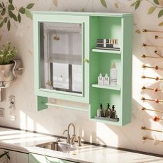 a green medicine cabinet in the corner of a kitchen