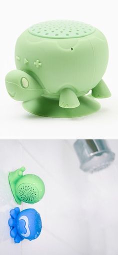 there are two different bathtub toys in the same photo, one is green and the other is blue