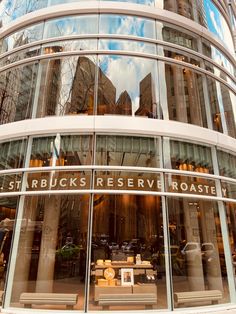 a large glass building with the words starbucks perserv roast on it's side