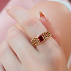 This stunning gold ring features a rectangular red Ruby gemstone set in a unique band design. A perfect blend of elegance and modern style, ideal for special occasions or daily wear. ❤️ All products are made with love, labor and care. They bring you the best wishes. 🎁 All products are sent in special packages.  👋 You can write to us for any question you have in mind. Questions, comments, or just want to say hi? 💎 All products are made by experienced craftsmen. 🛒 Ready to Ship in 2-3 Business Classic Rectangular Ruby Ring In Gold, Gold Rectangular Ruby Ring, Rectangular Gold Ruby Ring For Gift, Red Ruby Ring With Rectangular Stone For Gift, Rectangular Red Ruby Ring Gift, 14k Gold Ruby Ring, Ruby Wedding Rings, Ruby Ring Gold, Unique Bands