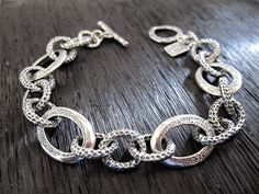 "Chunky, textured, chain link, sterling silver, statement bracelet (available in multiple lengths). A wonderfully unique, textured, chunky link bracelet! This bracelet is 1/2 of an inch wide and I offer it in multiple lengths (7\", 7 1/4\", 7 1/2\", 7 3/4\", 8\", 8 1/2\"). Custom lengths also available upon request. - Handmade - Sterling Silver - Length: Multiple Lengths Available - Width - 1/2 of an inch wide" Chunky Silver Bracelet, Texture Jewelry, Artisan Jewelry Handmade, Silver Link Bracelet, Handmade Jewelry Bracelets, Artisan Bracelets, Sterling Silver Bangle Bracelets, Bangle Bracelet Set, Silver Chain Style