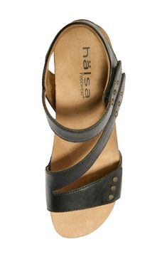 Brassy studs with textured detailing elevate a sun-ready sandal set atop a cork-cushioned wedge that has a stunning design. Lightweight: puts cushioning and performance underfoot with an emphasis on streamlined comfort 2" heel Adjustable hook-and-loop strap Cushioned footbed with arch support Leather upper/synthetic lining/rubber sole Imported Baby Gear Essentials, Rollerball Perfume, Makeup Gift, Fragrance Design, Wedge Sandal, Sandal Women, Emphasis, Black Fits, Shoe Sale