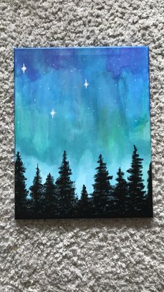 an acrylic painting of the night sky with stars and trees painted on it