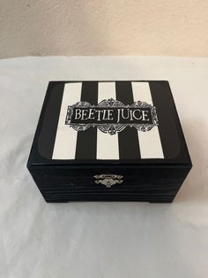 a black and white striped box sitting on top of a table