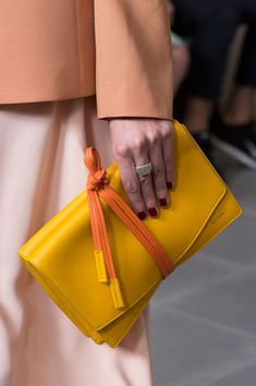 Paul Smith at London Fashion Week Spring 2016 - Details Runway Photos Clutch Bags | Potes | Baby Bags | Accessories Bags | Diaper Bags | Women Work Bags | Diy Bags | Fall Bags | Designer Clutch | Chanel Clutch | Wallet Clutch | Zipper Bags #acessories #streetstyle #clutchbag #bag #velvet #styleinspo #outfits #womensfashion #gold #diaperbag #walletclutch #chanelclutch #zipperbag Yellow Clutch, London Spring, Unique Bags, Fashion Mode, Paul Smith, Zipper Bags